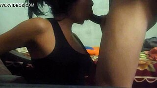 The student kneels for an oral exam, eagerly sucking the teacher's cock in the classroom