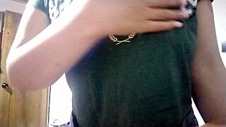 Latina girl touches her small natural tits while masturbating at grandma's house. She massages them slowly.