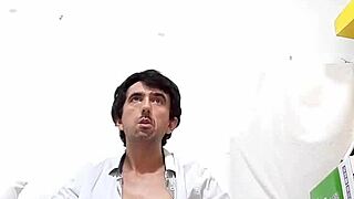 Fazendo strip tease, ripping off the social shirt and see-through black underwear, revealing a huge 25cm hard cock dripping with cum.