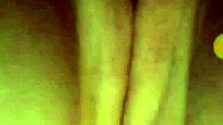 A young teen indulges in self-pleasure with her hands.