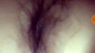 A young teen indulges in self-pleasure with her hands.