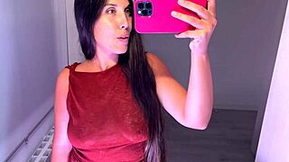 BRUNETTE TRIES ON TOPS, SHOWING BIG ASS