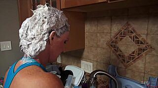 Deauxma mixes shampoo with a blowjob, her big tits on display