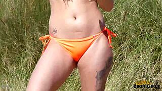 realbikinigirls - anna in an orange bikini looks so hot at the beach! 😍