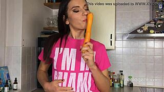 Russian star Nataly Gold rubs her tight hole with a carrot in kitchen solo
