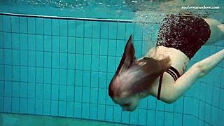 Suggestive-Neutral Dashka Stuns As Swimming Pool Beauty In Tight Bikini