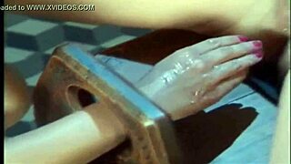 In the cage, she gets fucked with toys and cum