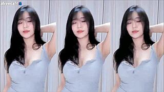 Korean cutie with big tits dances in sexy outfit