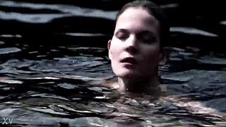 A blonde girl in a sexy bikini is swimming in the supernatural world.