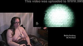 Naked brunette plays Outlast with natural tits in part 3