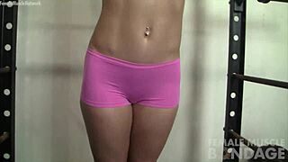 fit sexy muscle girl chained and bound in gym pov