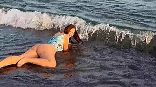 watch this horny teen on the beach, showing her big ass and pussy in public?