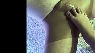 making my husband wear wet pantyhose for a kinky footjob.