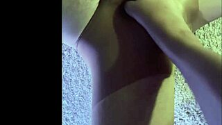 making my husband wear wet pantyhose for a kinky footjob.