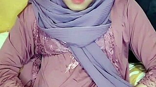 Indonesian crossdresser in hijab plays solo with pure heat