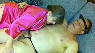 Granny Carmen Angel looks pretty in pink sucking cock! 😍