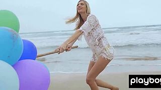 Skinny Italian milf blondie plays with balloons on the beach