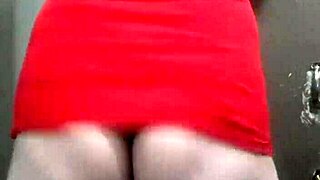 trans woman in a dress showing off her curves