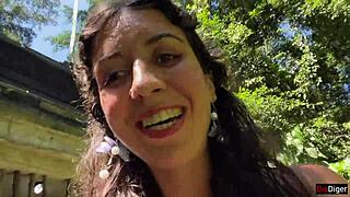 in the public locker room, she gets cum on her face, then walks to the waterfall with it