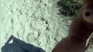 This slut is having sex on the beach