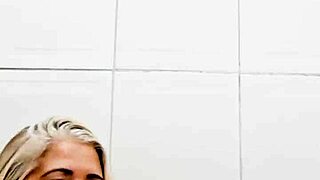 Blonde MILF toys her pussy solo in the bathroom