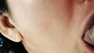 Young Guest Eagerly Enjoys Treat Hidden While Parents Rest Nearby