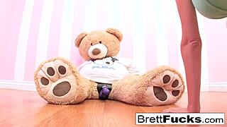 Busty Brett Rossi Plays With A Stuffed Bear's Strap-On Dildo