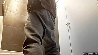 sexy bodybuilder masturbates big cock riskily in public bathroom
