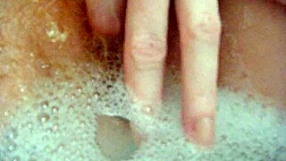 Annie bathes her big tits in the tub