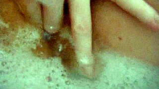 Annie bathes her big tits in the tub