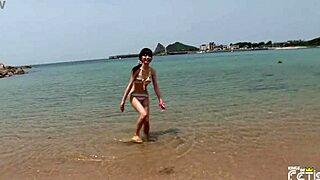 uh this skinny japanese chick is just enjoying her beach photoshoot all natural like