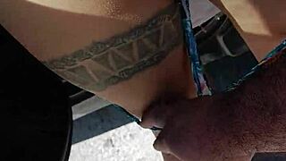 Check out the prostitute flashing her tattooed ass outdoors