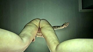 Hot tattooed babe dances nude seductively.