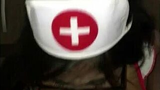 a young latina nurse helps her patient with care in the busy hospital environment