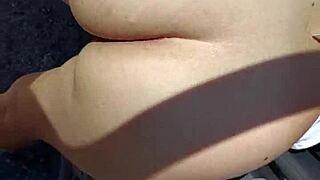 Check out the prostitute flashing her tattooed ass outdoors