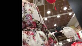 I spy on the hot granny in her skirt at the shop, upskirt view