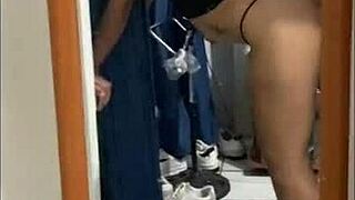 latina amateur poses in front of mirror