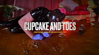 dominatrix mistress april teases slave with cupcake and toes