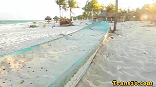 Glamorous tattooed Latina relaxes in the shower wearing a bikini