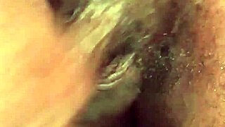 Kennesaw gives sloppy handjob to big black cock in detailed close-up