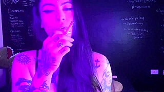 Lexi smokes while masturbating her big pussy.