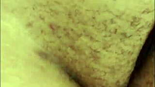 African beauty pleasures herself outdoors, defying the norms of her neighborhood.