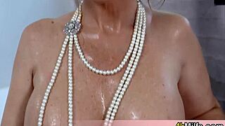 redhead busty stepmom having fun in the bathtub but she needs more than a shower head