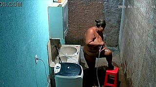 hidden camera catches stepmother shaving while stepson watches secretly.