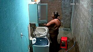 hidden camera catches stepmother shaving while stepson watches secretly.