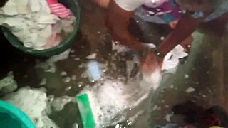 Sexy aunty washes her dress in the bathroom while surrounded by family and friends