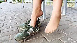tan nylon soles peek from blue jeans on the bench