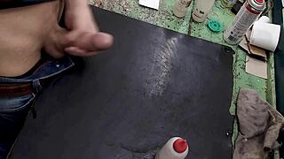 skinny young amateur masturbates big cock on workbench at work