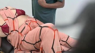 An indian doctor checks a lady patient in the clinic