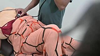 An indian doctor checks a lady patient in the clinic